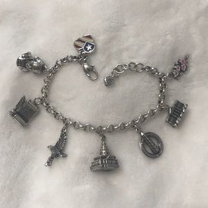 8 charm Brighton bracelet representing DC